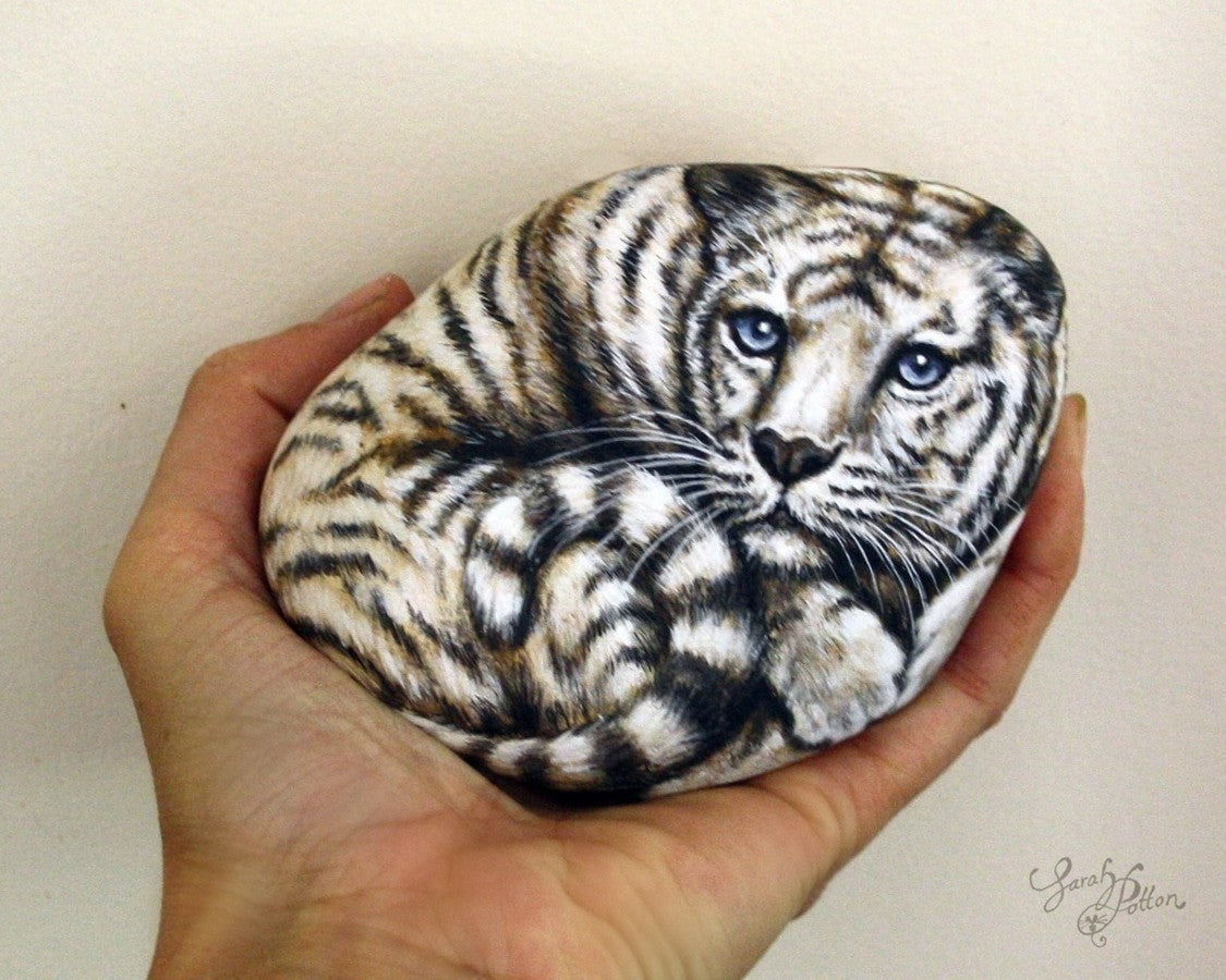 white tiger painting on a stone - realistic art