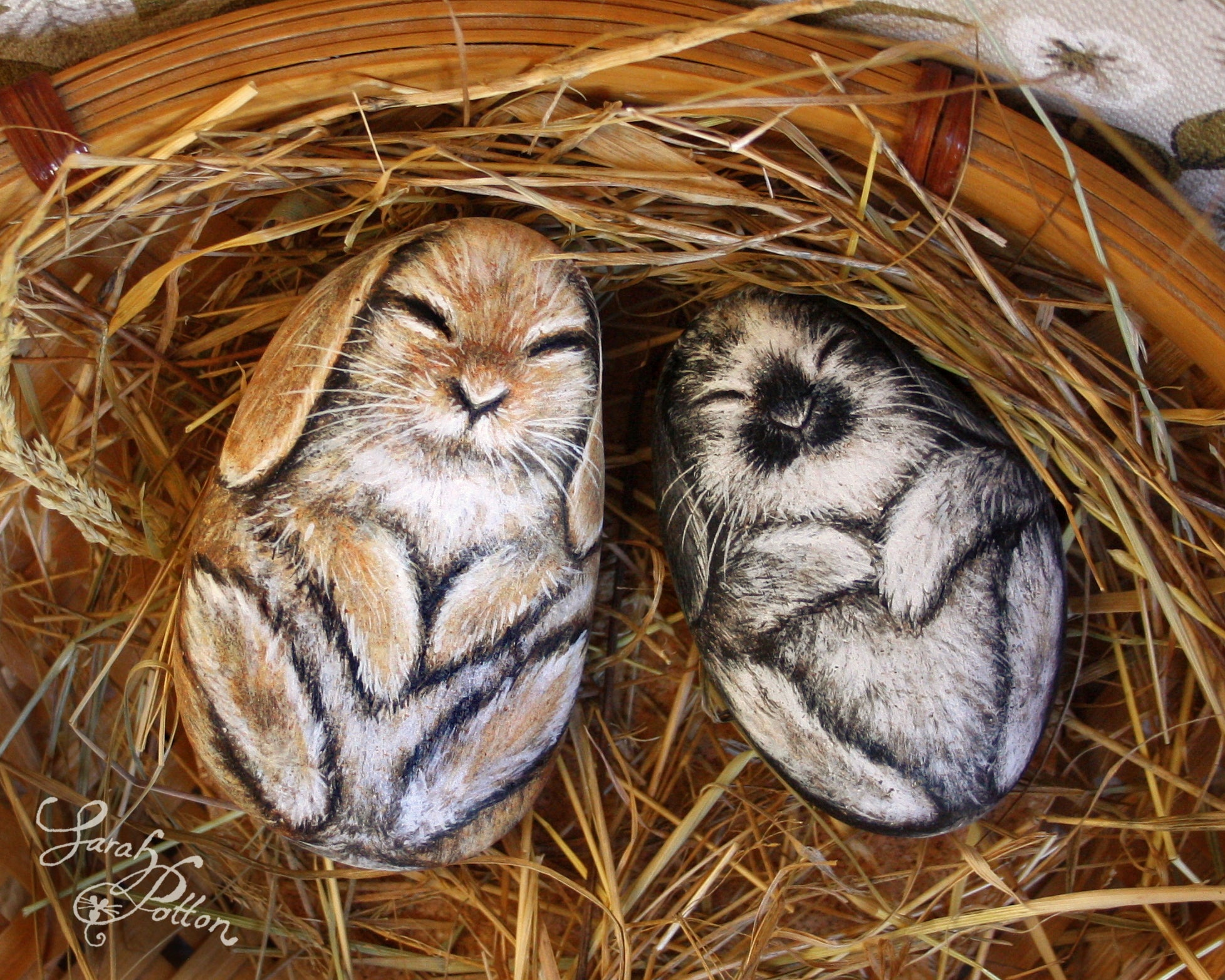 painted rocks of sleeping rabbits - bunny ornaments