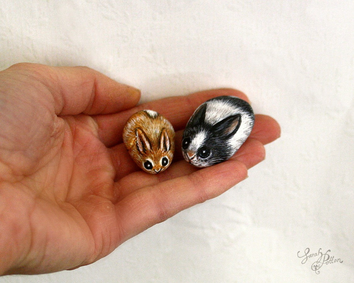 miniature art painted rocks of tiny bunnies